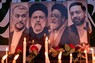 イラク・バグダッドのイラン大使館前に追悼のために掲げられたライシ大統領（左から2番目）ら犠牲者の写真＝20日、ロイター