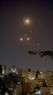 ヨルダンの首都アンマン上空を通過するイランの無人機とみられる飛翔体＝2024年4月14日、ソーシャルメディアに投稿された動画から・ロイター