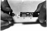 オリンパスと東大病院が共同開発し、1950年に初めて臨床実験に成功した胃カメラのカメラ部分。（1）はフィルムマガジン（2）フィルム（3）ランプ（4）レンズ