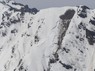 雪崩が発生し、山肌が見える北アルプスの針ノ木雪渓上部＝長野県警提供